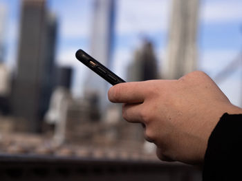 Close-up of hand holding smart phone