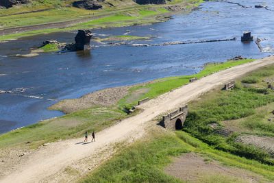 High angle view of lake amidst field