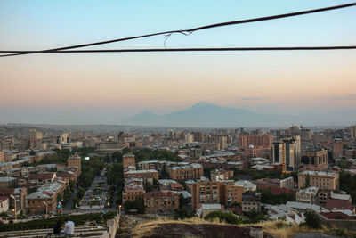 High angle view of cityscape against sky during sunset