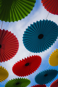 Low angle view of multi colored umbrellas hanging on ceiling