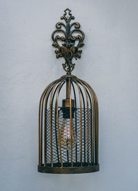 Close-up of metal hanging against wall