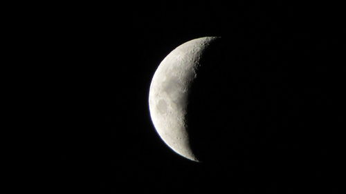 Low angle view of moon against clear sky at night