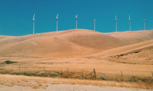 Scenic view of landscape against blue sky