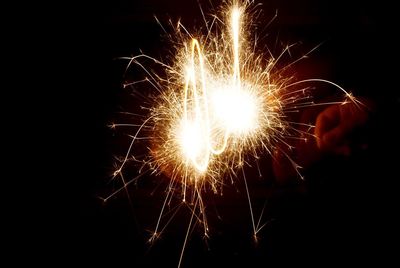 Close-up of firework display at night