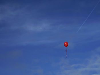 Low angle view of  red hot air balloonagainst sky