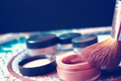 Close-up of make-up objects on table