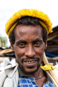 Close-up portrait of smiling young man