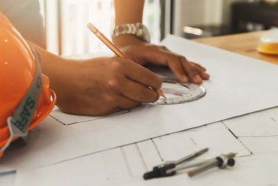 High angle view of man hand on table