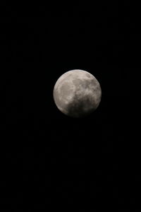 Low angle view of moon against sky at night