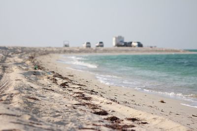 Scenic view of beach against clear sky