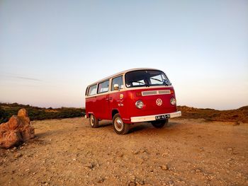 Vintage car on road against clear sky