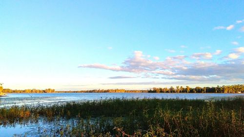 Scenic view of lake against sky during sunset