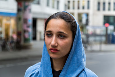 Close-up of young woman wearing hooded shirt