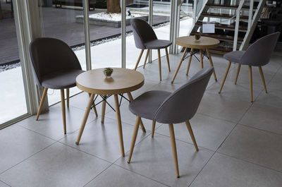 High angle view of chairs and table in restaurant