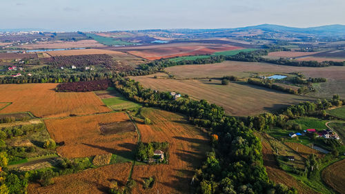 Flight over the fields behind the western ukrainian village aerial view