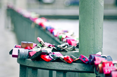 Close-up of padlocks on railing