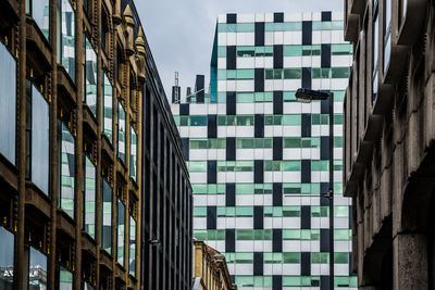 Low angle view of old and modern buildings