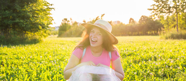Portrait of smiling woman on field