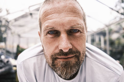 Close-up portrait of man wearing mask