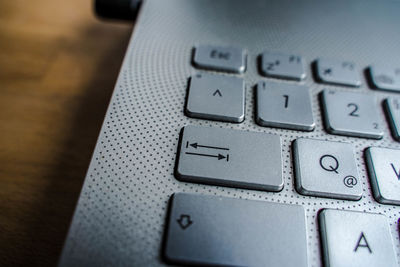 Close-up of laptop keyboard on table