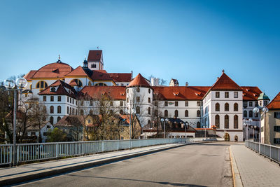 Street amidst buildings against sky