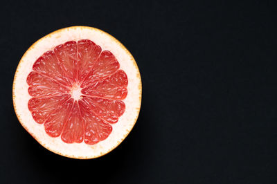 Close-up of lemon slices on black background