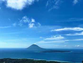Scenic view of sea against blue sky