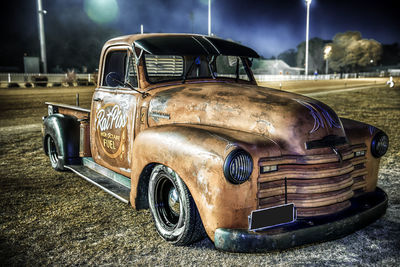 Old vintage car on street at night