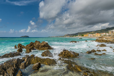 Scenic view of sea against cloudy sky