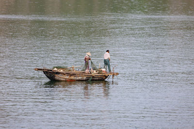 Men in boat on sea