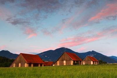 Rural landscape with traditional barns and velka fatra national park.