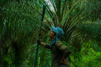 Side view of a man in forest