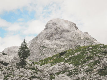 Low angle view of rock formation against sky