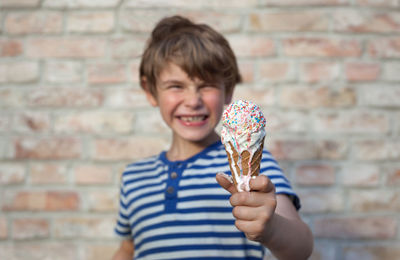 Portrait of boy holding ice cream