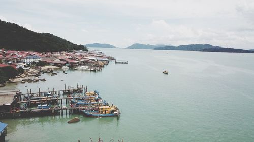 High angle view of boats in sea against sky