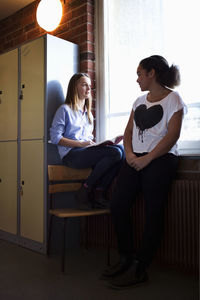 Schoolgirls in locker room