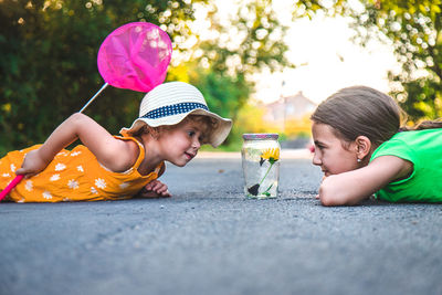 Full length of boy playing with toy on road