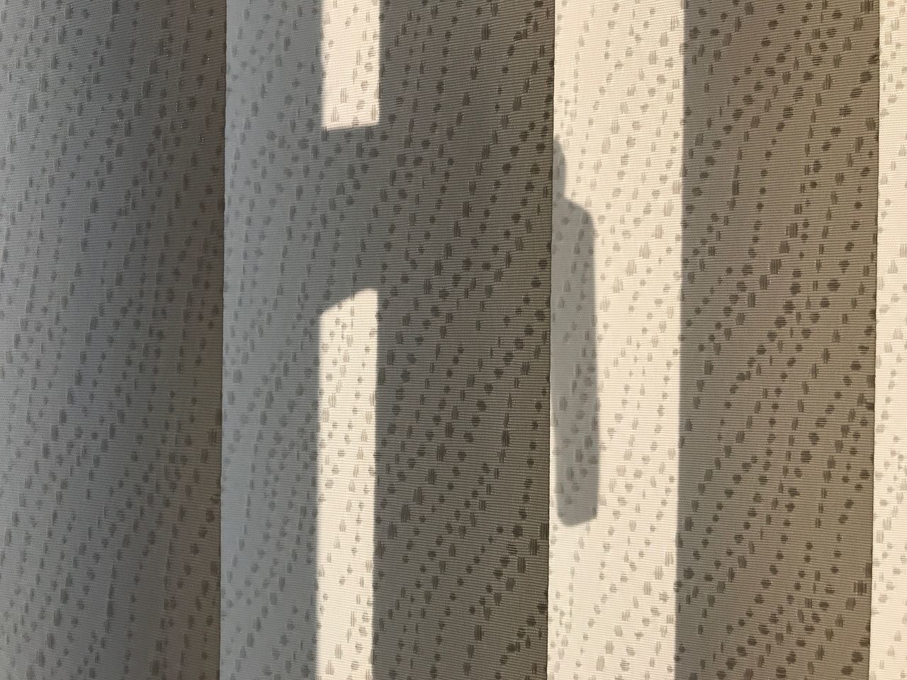 FULL FRAME SHOT OF CURTAIN ON WALL