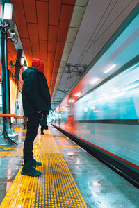 Blurred motion of train at railroad station