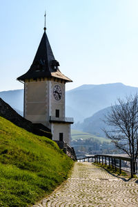 Church by building against sky