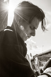 Portrait of woman looking at sunny day