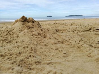 Scenic view of beach against sky