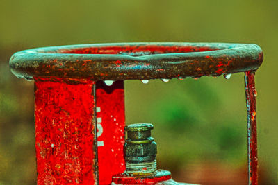 Close-up of water drops on rusty metal