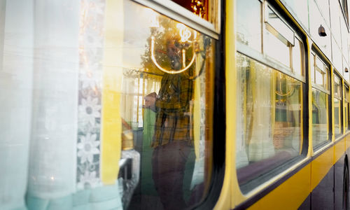 Reflection of train on glass window