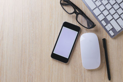 High angle view of smart phone on table
