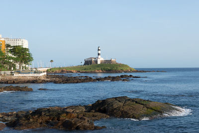 View of the sea and farol da barra, postcard of the city of salvador, bahia.