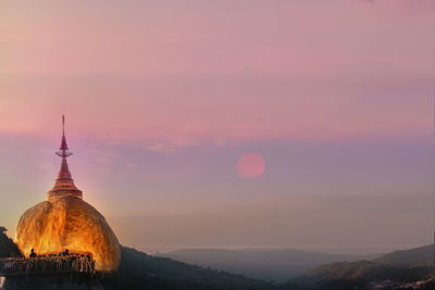 Temple against sky during sunset