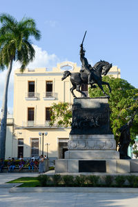 Statue in front of building