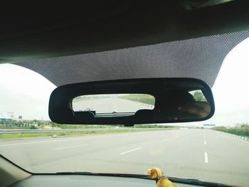 Empty road seen through tunnel