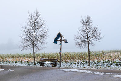 Bare trees against clear sky